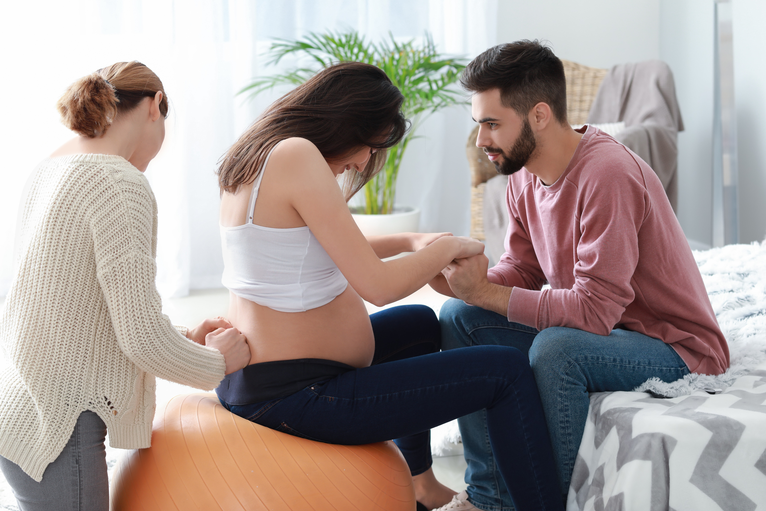 Pregnant Couple with Doula at Home
